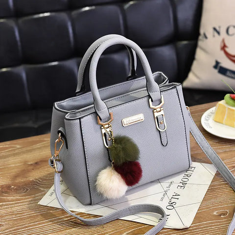 Elegant Women's Handbag with Pom - Shoulder and Crossbody Bag