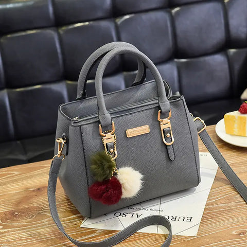 Elegant Women's Handbag with Pom - Shoulder and Crossbody Bag